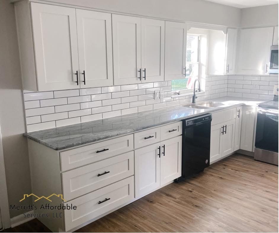 Small kitchen renovation in Bartow, FL with white shaker cabinets, subway tile backsplash, and granite countertops