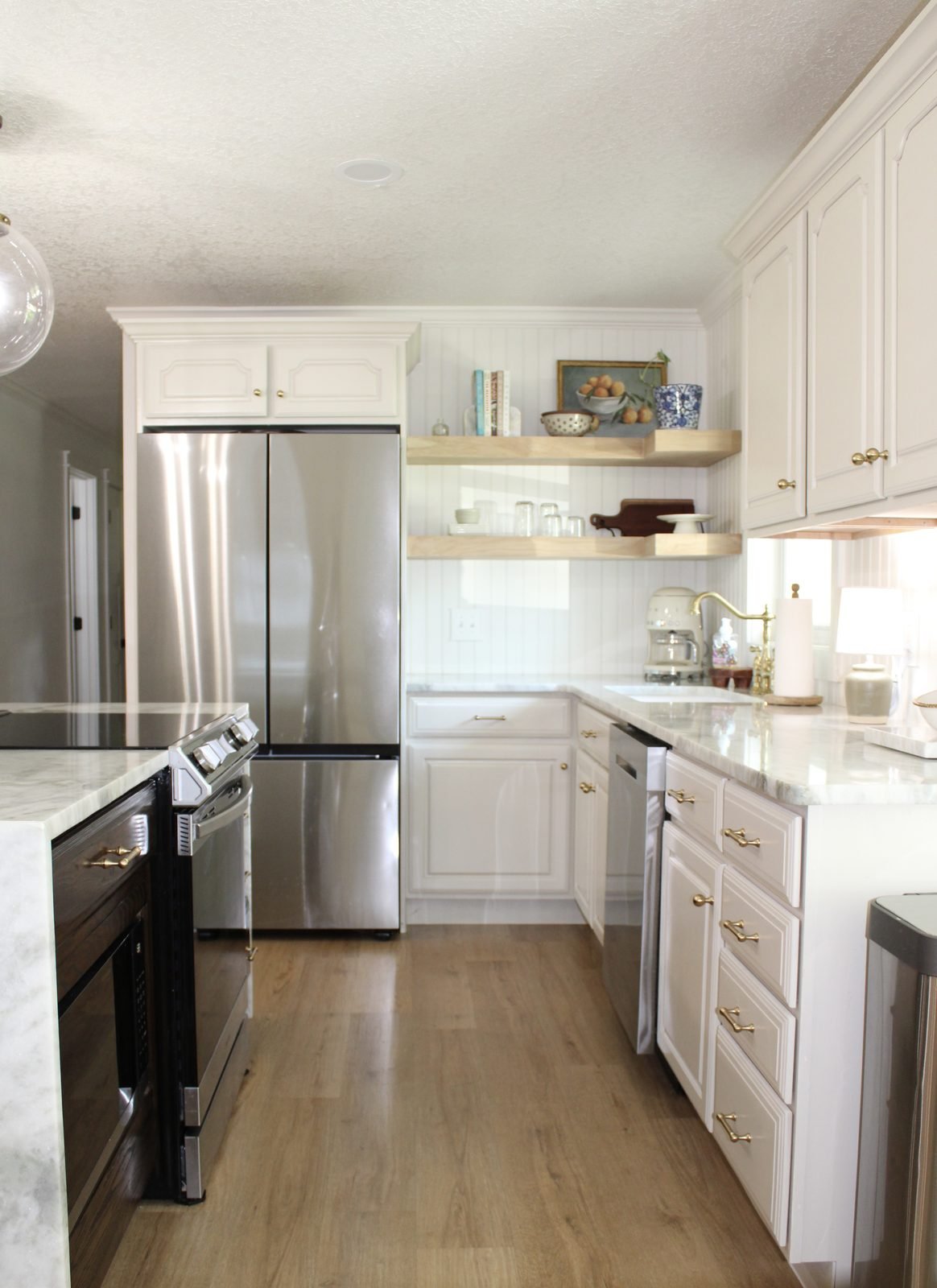 White shaker kitchen remodel with floating shelves in Polk County, FL